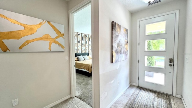 entryway with light tile floors