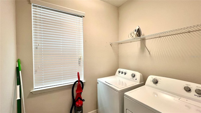 laundry room with separate washer and dryer