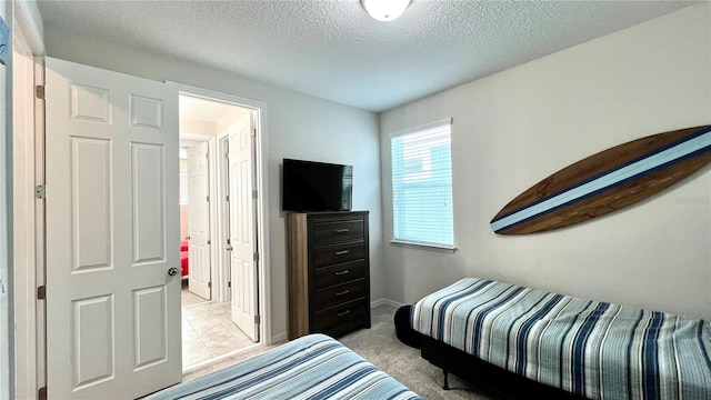 carpeted bedroom with a textured ceiling