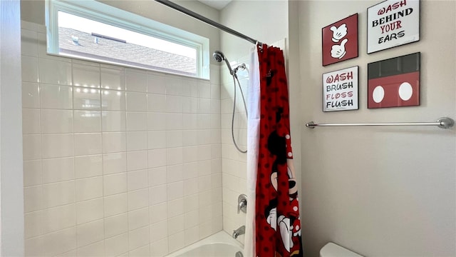 bathroom with shower / tub combo with curtain