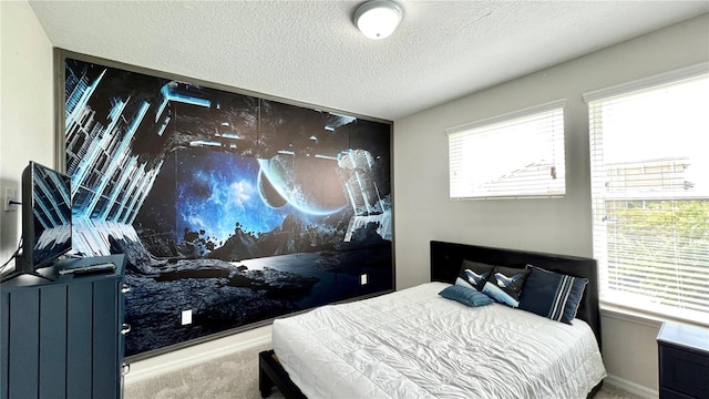 carpeted bedroom featuring a textured ceiling