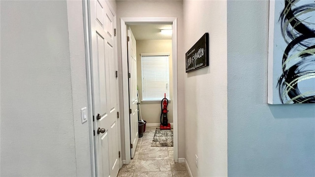 hallway featuring light tile floors