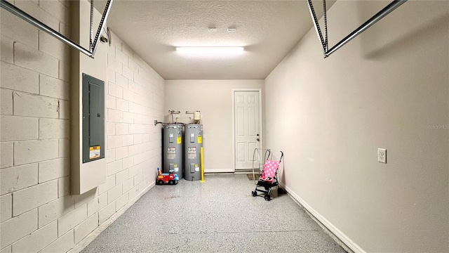 interior space featuring water heater and a textured ceiling