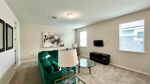 interior space featuring a wealth of natural light and a textured ceiling