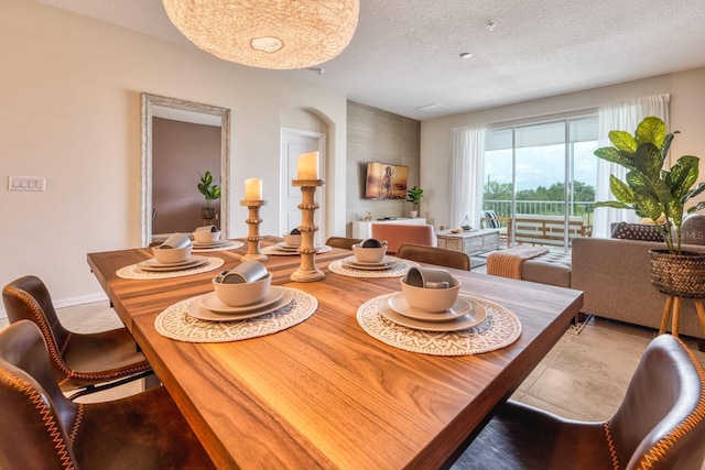 dining space featuring a textured ceiling