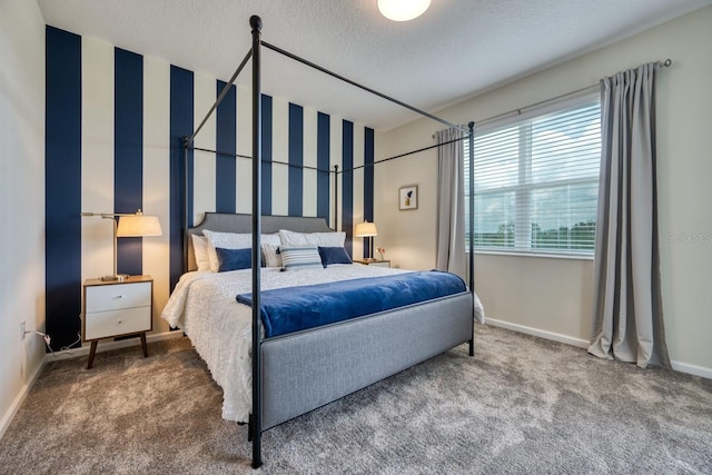 carpeted bedroom featuring a textured ceiling