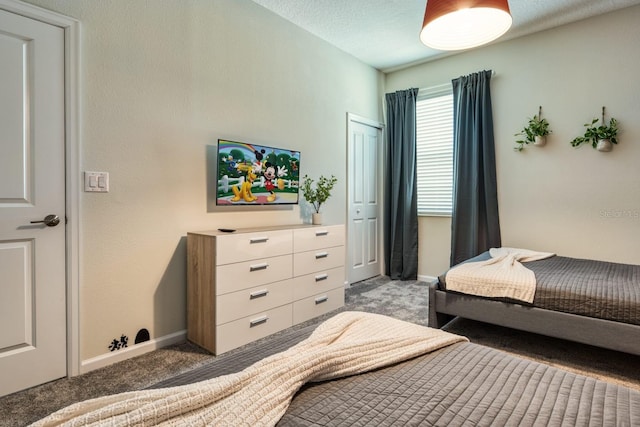 bedroom featuring a closet and light carpet