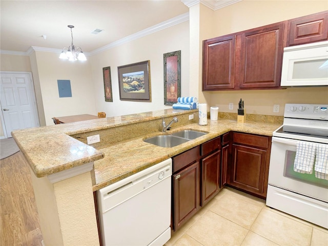 kitchen with white appliances, ornamental molding, sink, and decorative light fixtures