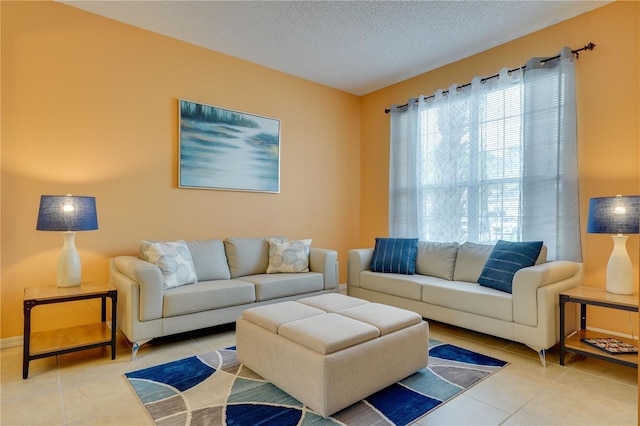 tiled living room with a textured ceiling