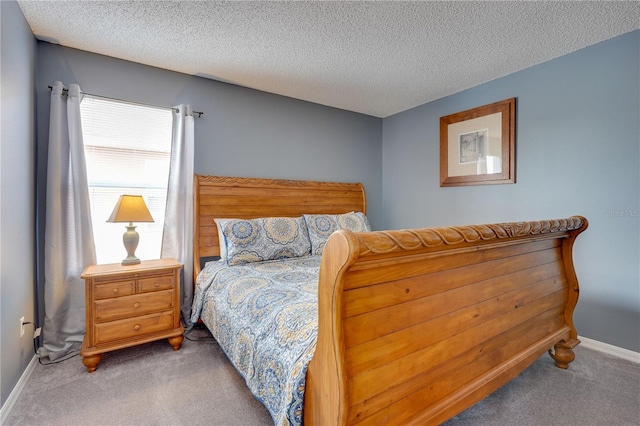 carpeted bedroom with a textured ceiling