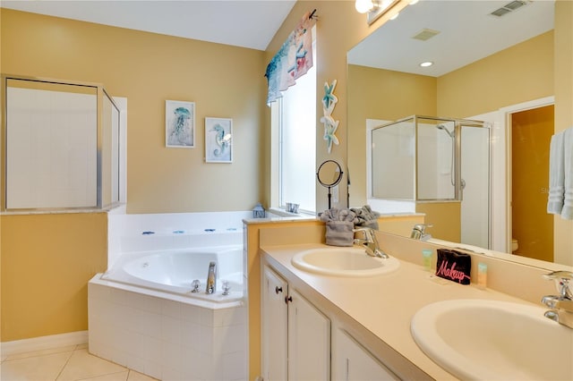 full bathroom with tile patterned flooring, vanity, shower with separate bathtub, and toilet