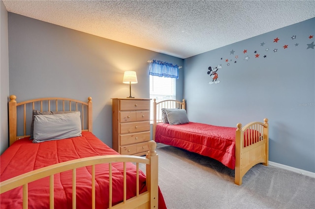 bedroom with carpet floors and a textured ceiling