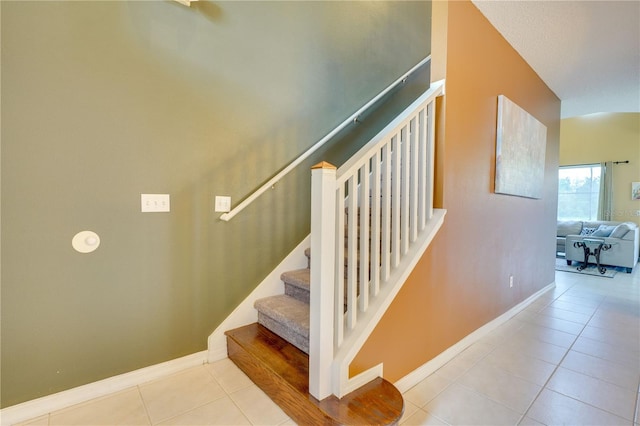 staircase with tile patterned floors