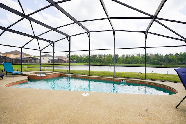 view of pool with an in ground hot tub, a water view, a patio, and glass enclosure