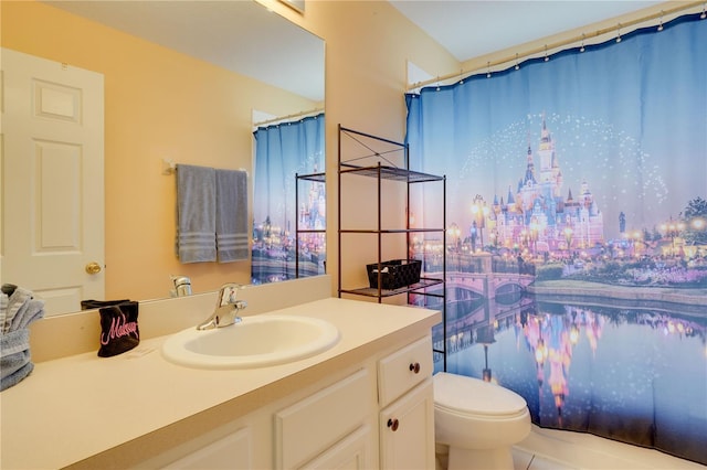 bathroom with vanity, a shower with shower curtain, and toilet