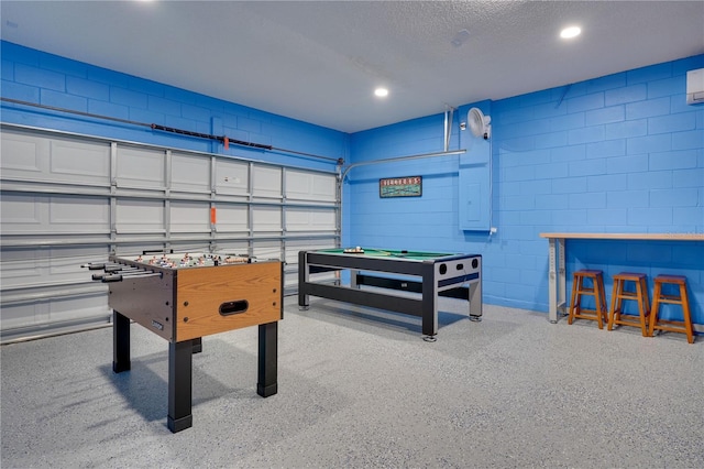 game room featuring a textured ceiling