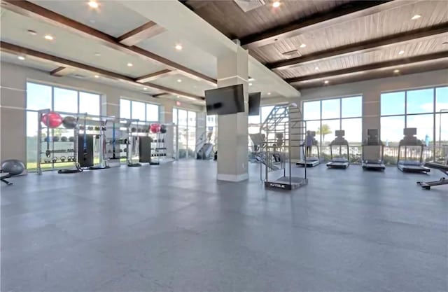 gym featuring wood ceiling and plenty of natural light