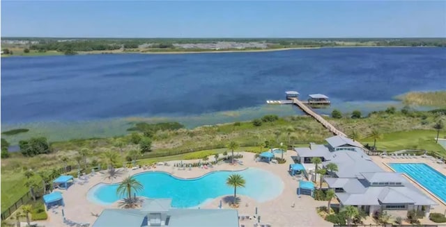 birds eye view of property featuring a water view