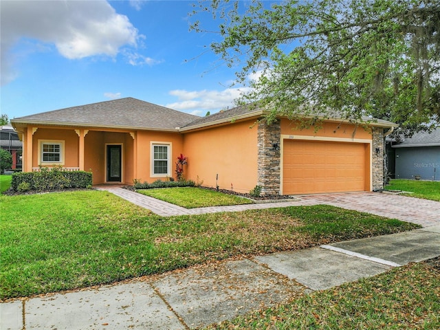 ranch-style house with a front yard and a garage