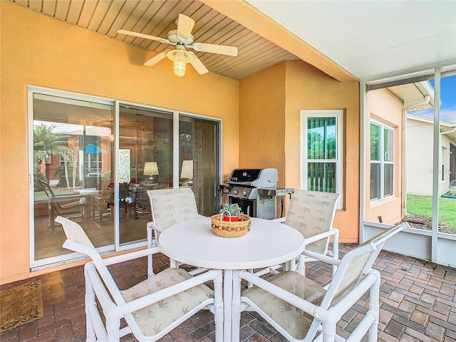 view of patio featuring ceiling fan and grilling area