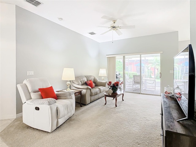 carpeted living room featuring ceiling fan