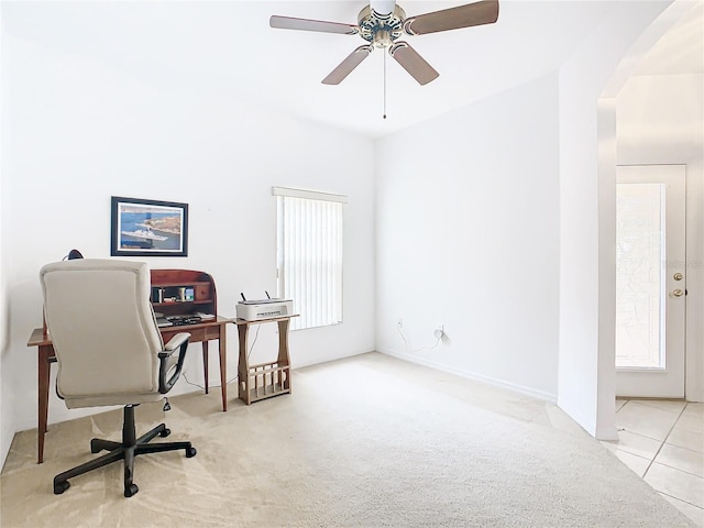 tiled office space with ceiling fan