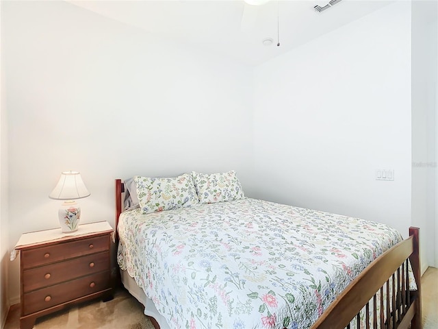 bedroom featuring light colored carpet