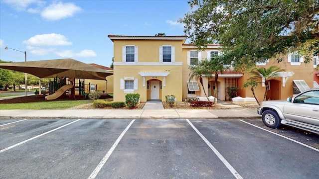 view of front of home with a playground