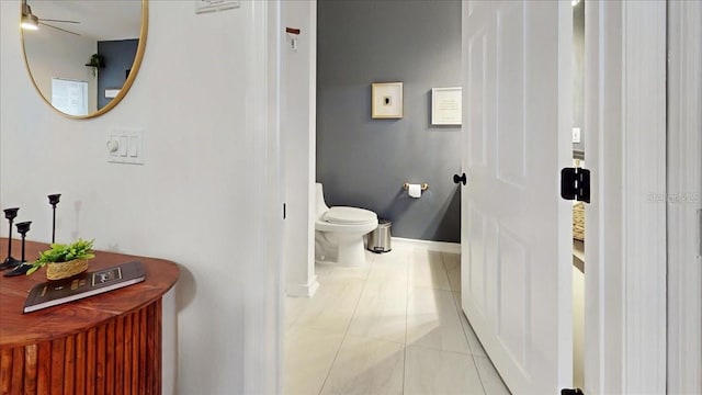 bathroom with toilet and tile flooring