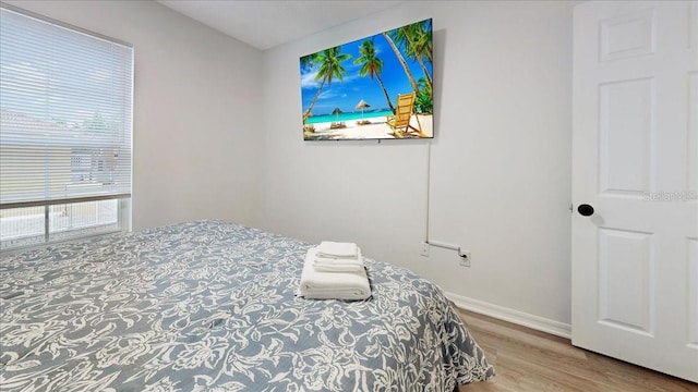 bedroom featuring hardwood / wood-style flooring