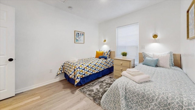 bedroom with light hardwood / wood-style flooring