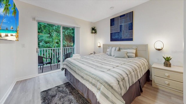 bedroom with access to exterior and light wood-type flooring