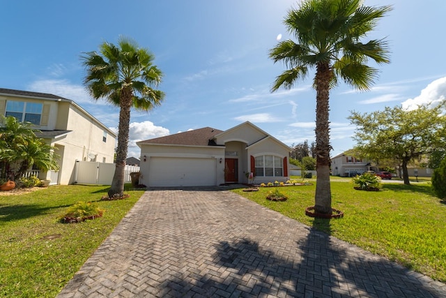 view of front facade featuring a front lawn and a garage