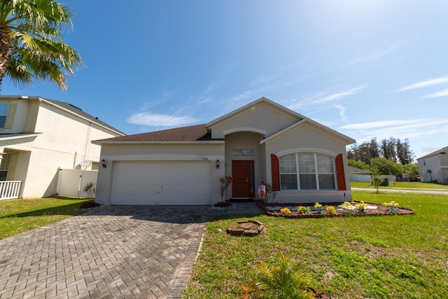 ranch-style house with a front yard and a garage