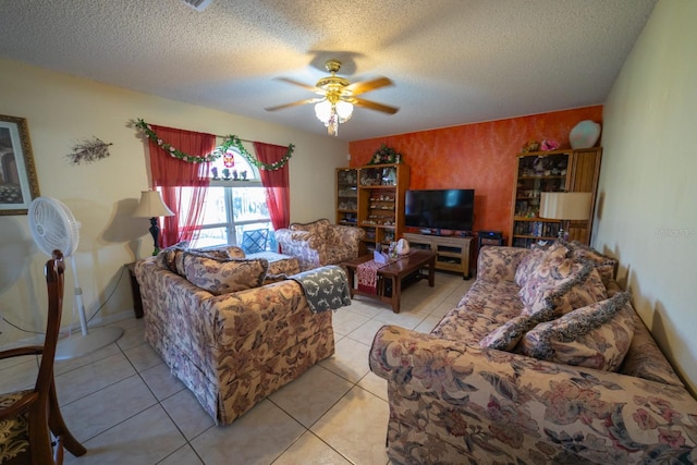 tiled living room with ceiling fan and a textured ceiling