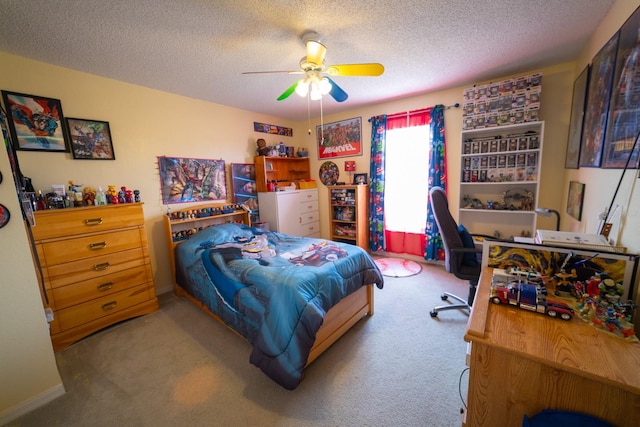 bedroom with ceiling fan, a textured ceiling, and light carpet