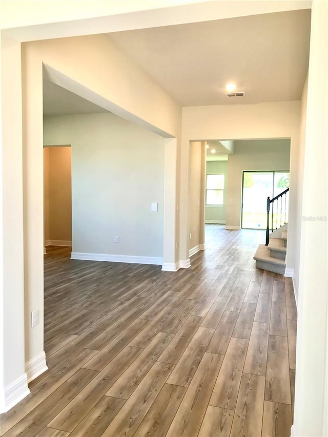 spare room with dark hardwood / wood-style floors