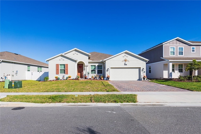 view of front of property with a front yard and a garage