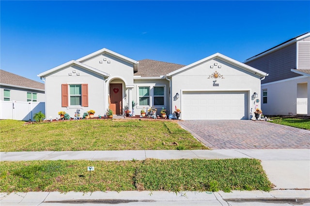 ranch-style home with a front yard and a garage