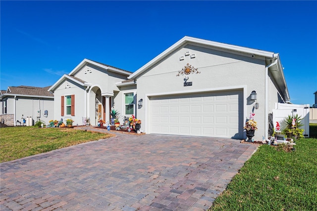 ranch-style house with a front yard and a garage