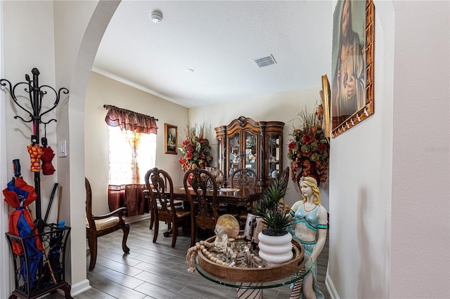 dining space featuring dark hardwood / wood-style floors