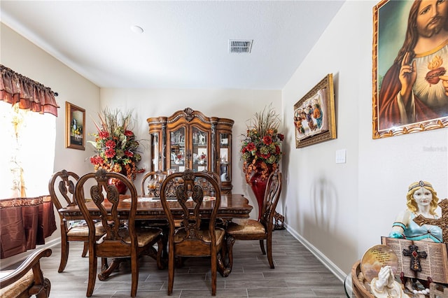 dining space featuring dark hardwood / wood-style floors