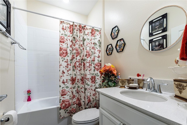 full bathroom featuring toilet, shower / bath combo with shower curtain, and vanity with extensive cabinet space