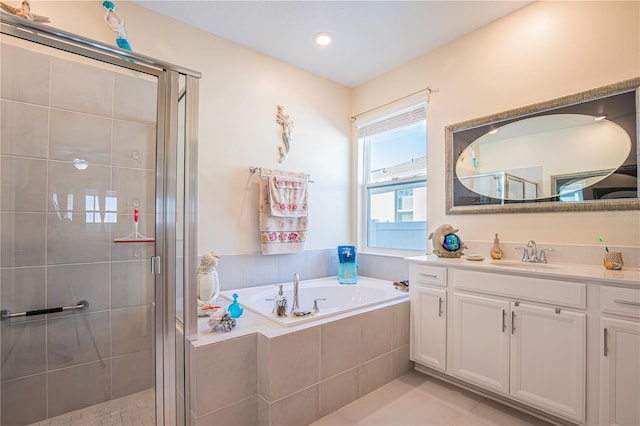 bathroom featuring tile floors, vanity, and plus walk in shower