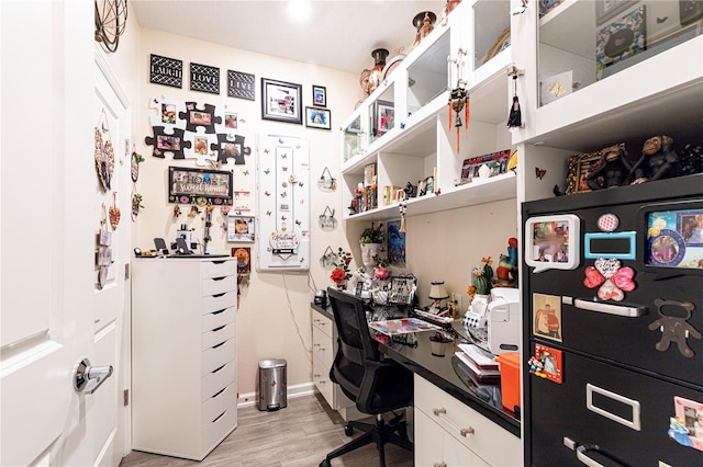 home office featuring light hardwood / wood-style floors