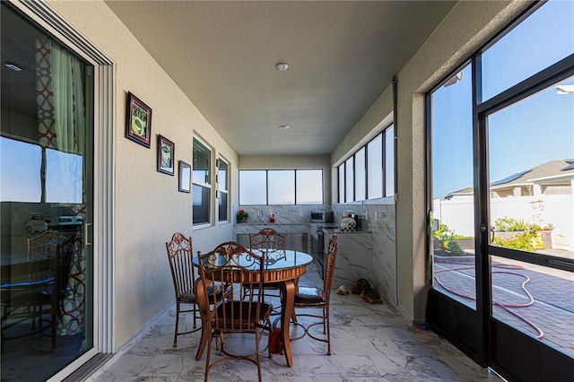 sunroom featuring plenty of natural light