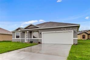 ranch-style home featuring a front lawn and a garage