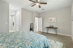 bedroom with hardwood / wood-style floors and ceiling fan