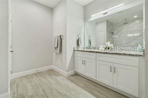 bathroom featuring hardwood / wood-style floors and vanity