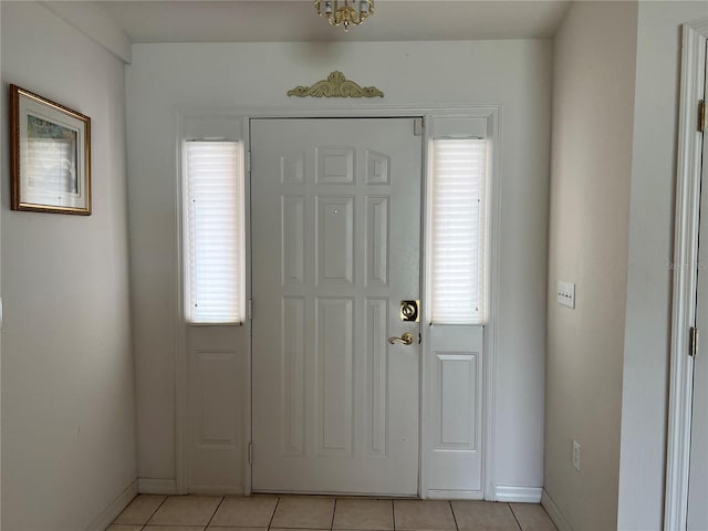 tiled entrance foyer featuring a wealth of natural light